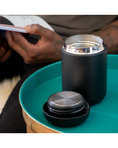 Fellow Carter Wide Mug 12oz Matte Black on side table