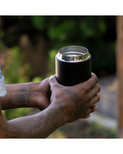 Fellow Carter Wide Mug 16oz Matte Black held in 2 hands