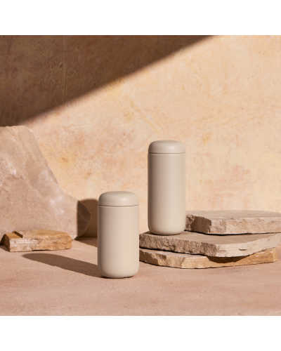 Fellow Carter Move Mug 12oz Sand Dune with sand background.