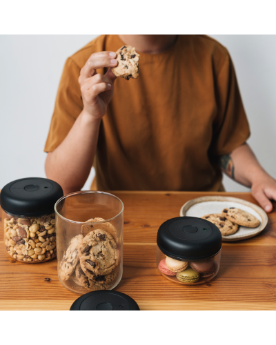 Fellow Atmos Canister 1.2L Clear Glass person eating cookie out of jar