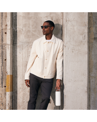 Fellow Carter Carry 20oz Matte White Carried by male person