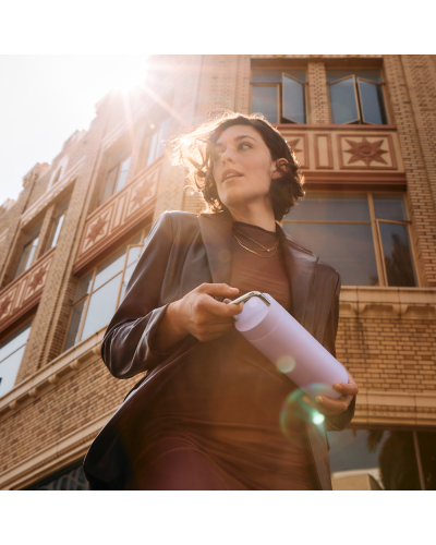 Fellow Carter Carry 20oz Periwinkle Lilac carried by lady walking the street