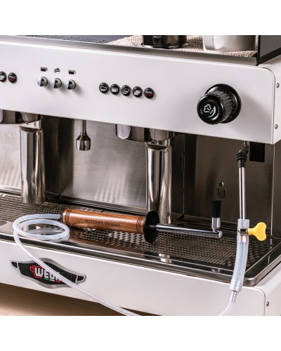 Studio Barista Steam Cleaning Brush 30cm Walnut attached to steam wand.