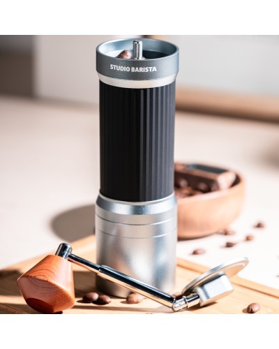 Studio Barista Manual Coffee Grinder with Foldable Handle Grey on table