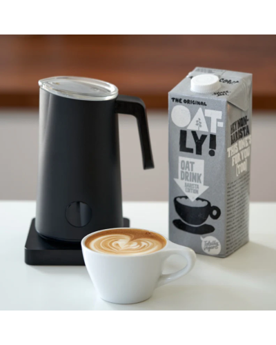 Subminimal NanoFoamer PRO with oatly milk and cup of coffee