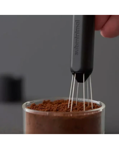 Subminimal Flick WDT Distribution Tool in use with ground coffee