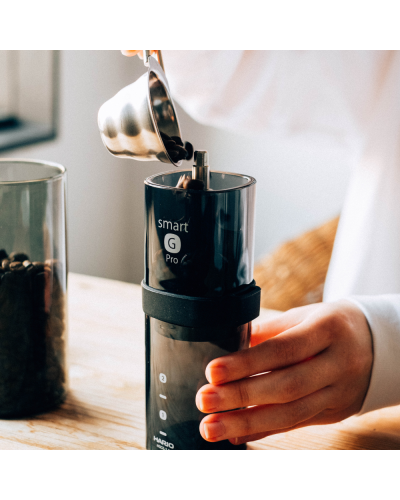 Hario Coffee Grinder Smart G Pro Pouring coffee into grinder