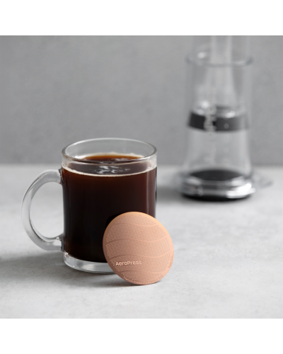 AeroPress Metal Filter Gold Tone with coffee cup